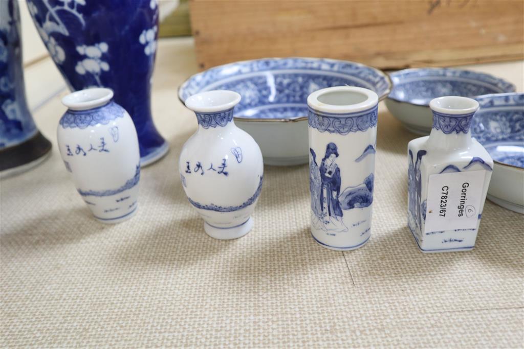 A graduated set of three Chinese porcelain blue and white bowls, largest 19cm and a group of four miniature Chinese blue and white vase